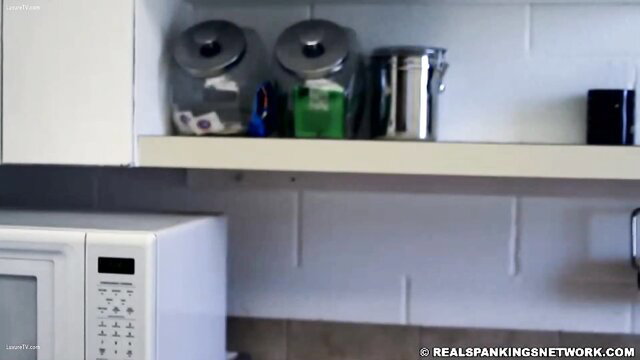 Kitchen shelf with soap jars and mouth soaping tools by microwave