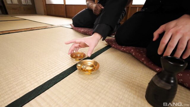 Naomi Togo in elegant kimono pouring sake at tatami room JAV scene