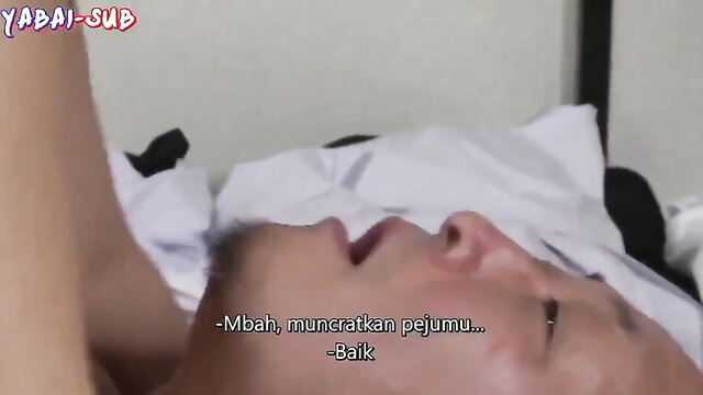 Asian man sleeping as woman spits semen on his face in JAV scene