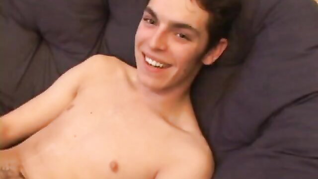 Brady Walker shirtless smiling on bed in gay porn thumbnail