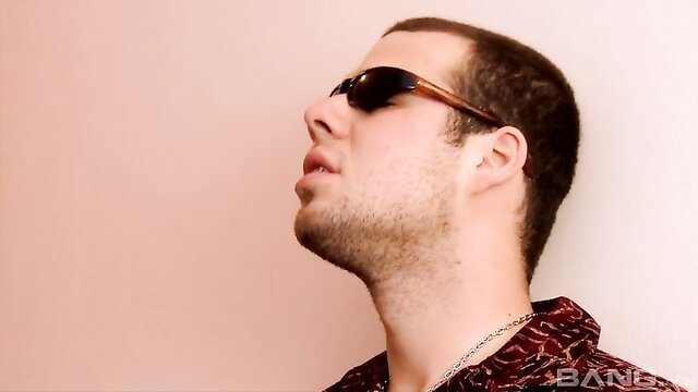 Hot guy in shades and red shirt adores feet in fetish thumbnail