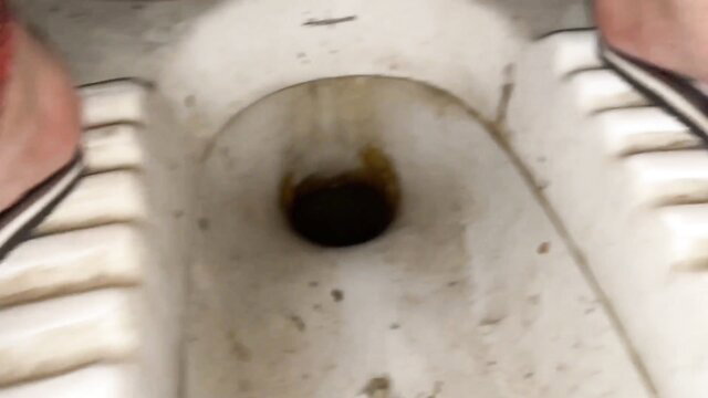 Desi Indian sub damsel squatting over toilet peeing in Indian douche