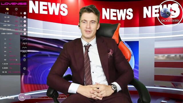 Handsome young suited man in news studio chair, interactive toy play