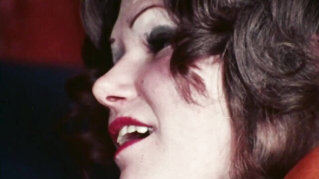 Smiling brunette retro babe with red lips in 1975 vintage porn thumbnail