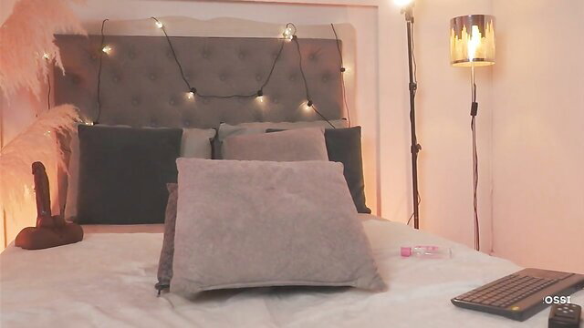 Victoria Cross's cozy bedroom with dildo on bed, pink lighting