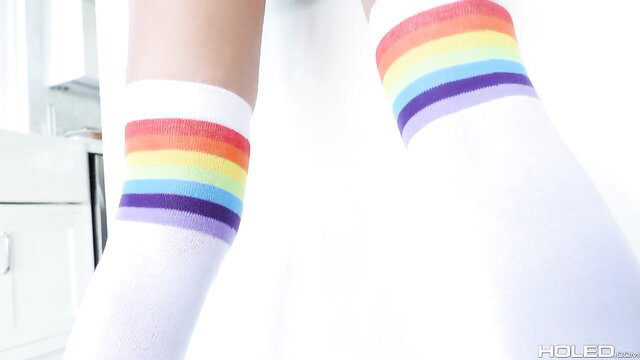 Adria Rae in rainbow thigh high socks, sexy legs up close