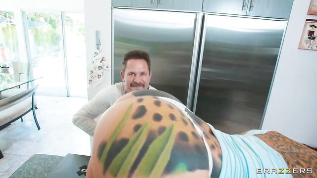 Man gropes curvy woman's huge tattooed ass in kitchen