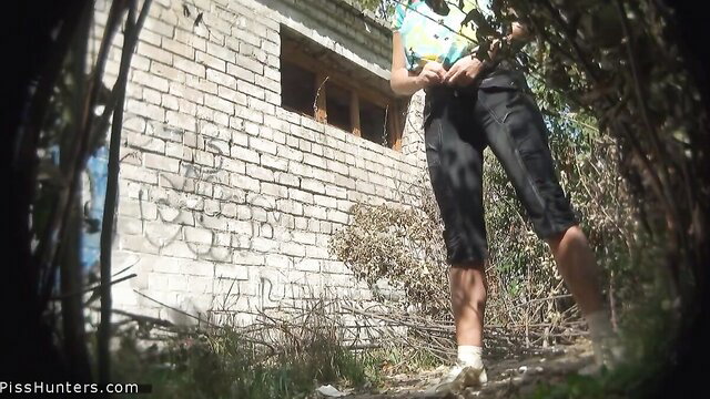 Amateur blonde squats outdoors peeing on spy cam video