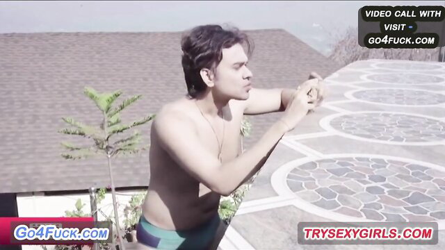 Shirtless Indian guy in speedo on rooftop video call flirt