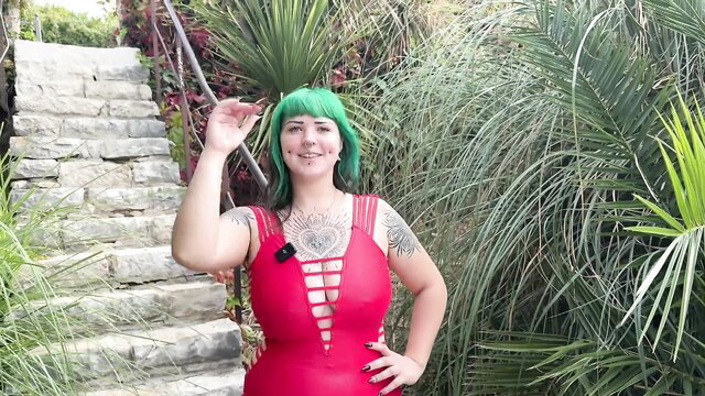 Green-haired tattooed Lilith in red cutout dress outdoors, 20yo slut