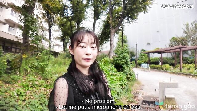 Slender Japanese Ayu-chan smiling outdoors, black sheer top, JAV thumbnail