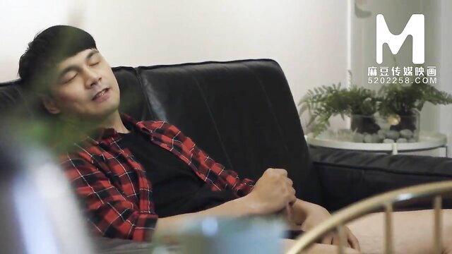 Asian man asleep on couch in red plaid shirt, Madou Media JAV thumbnail