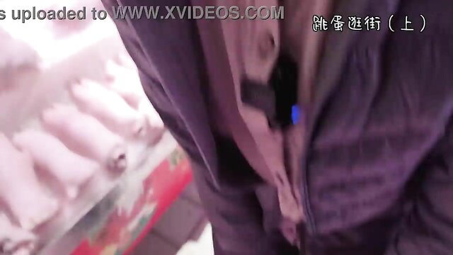 Asian woman shopping with vibrating egg remote in purple dress, part 1
