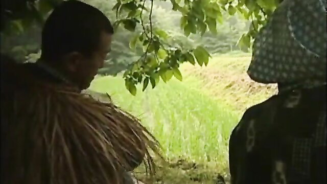 Showa era Japanese stepmom in field with man, nostalgic JAV thumbnail