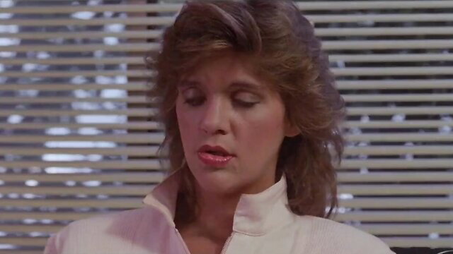 Ginger Lynn in sexy pink blouse, closeup portrait from Taboo 4