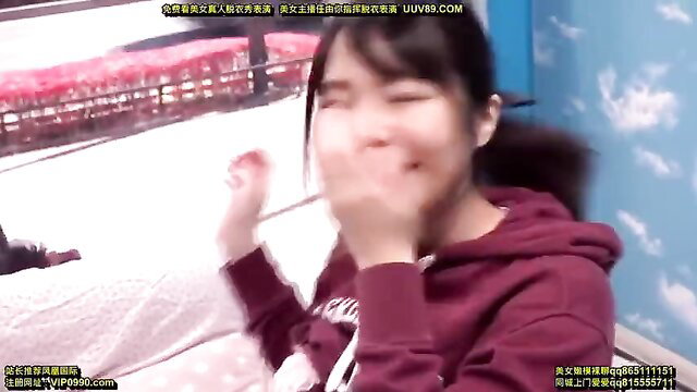 Cute Asian girl in hoodie covers mouth laughing, amateur JAV thumbnail