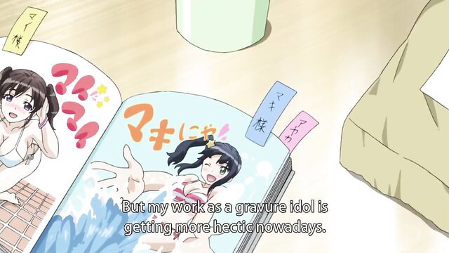 Cute anime idol in bikini reads hectic gravure work manga, smiling excitedly