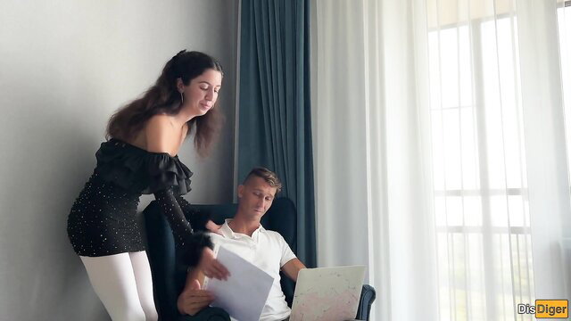 Brunette secretary in sparkly black dress and white pantyhose over man