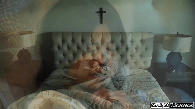 Woman lying in bed with a shocked expression