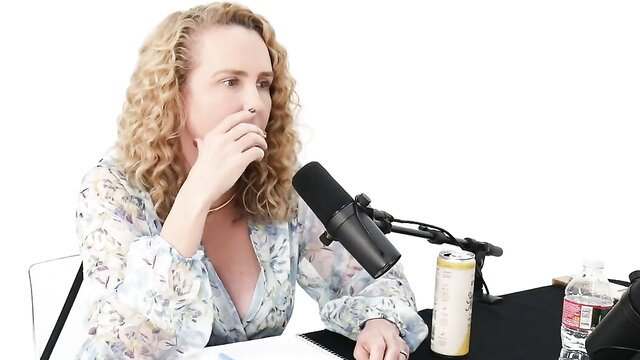 Stormy Daniels on podcast in cleavage blouse, hot blonde MILF