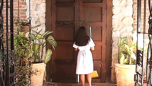 Brunette Laura in white sundress at door, vintage tease
