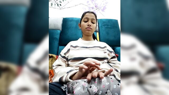 Aleena Rai meditating in cozy sweater and pants, young Indian beauty