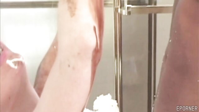 Busty cougar with massive tits covered in cum in steamy shower