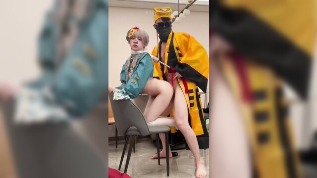 77bandage in Chinese costume, legs spread exposing tight Asian pussy