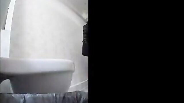 Voyeur cam spying on hot Russian girl pooping on white toilet