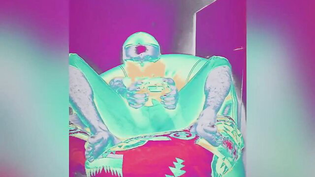 Neon-lit gamer brother-in-law sits spread-legged holding controller in trippy pose