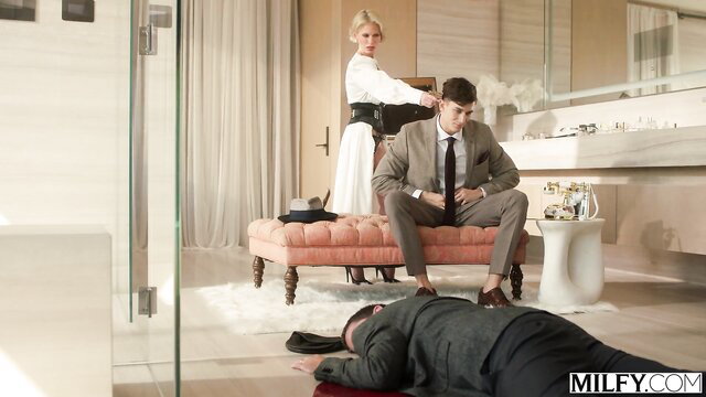 Casca Akashova in white dress over dead body with suited man on MILFY