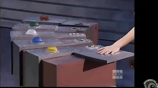 Bikini babe with great body on game show pressing colorful buttons