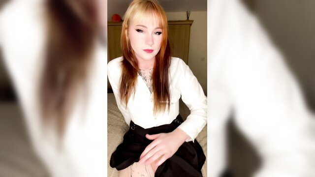 Hot trans gal with blonde red hair in white blouse black skirt solo tease