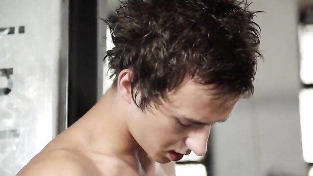Handsome young man with tousled hair, topless profile view closeup