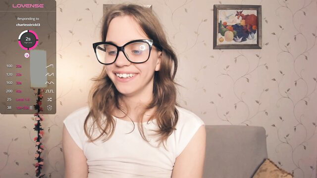 Cutefluffy in glasses and white top during a cam show