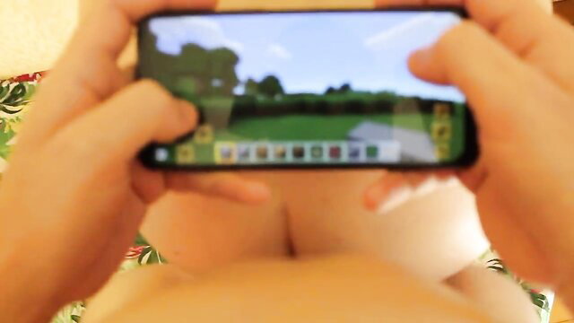POV amateur wife cleavage tease playing Minecraft on phone