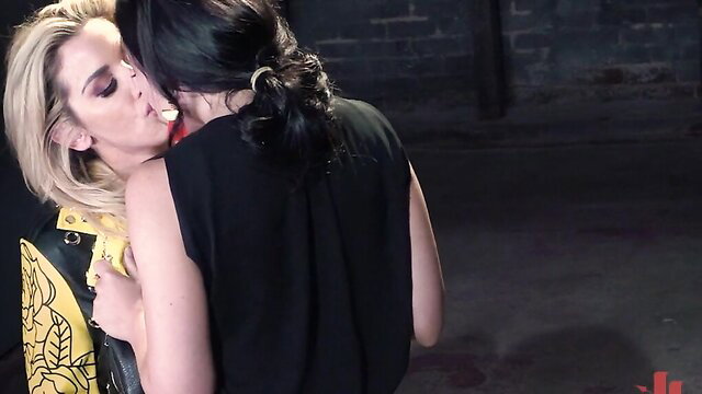 Blonde and brunette lesbians kissing passionately in WhippedAss The Recruit