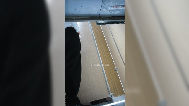 Chinese woman spied on toilet from behind, bending over in stall
