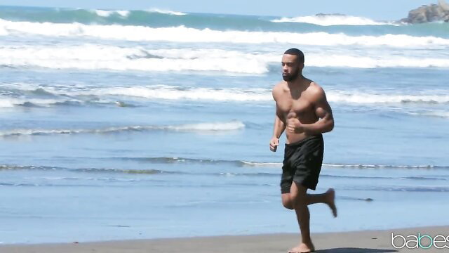 Hot black muscular man running shirtless on beach, Babes seaside tease