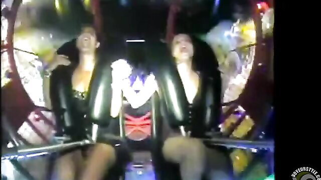Hot upskirts of two brunettes flashing on amusement ride