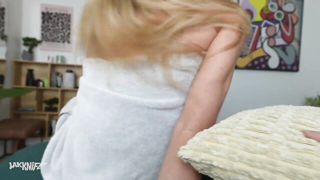 Blonde Addison Vodka in towel holding pillow, sexy teaser