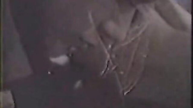 Blurry closeup of woman with big tits and cumshot on dark skin