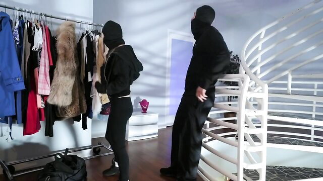 Lexi Luna in black hoodie and leggings in burglary sex adventure scene