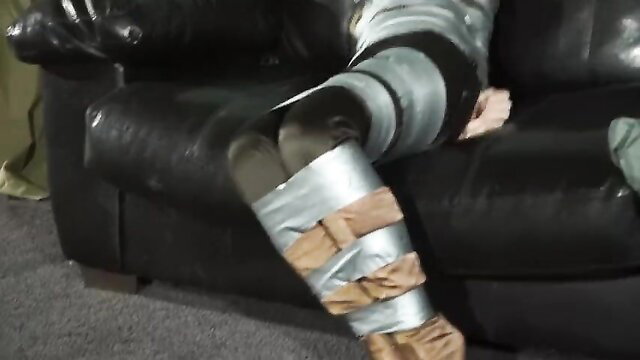 mistress binding ankles with duct tape