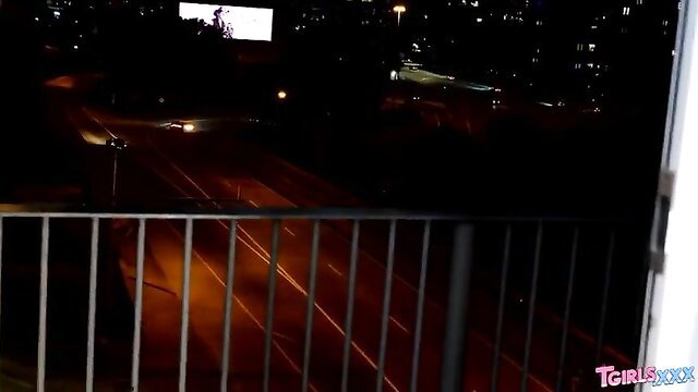 Hot trans babe balcony night view city skyline tease