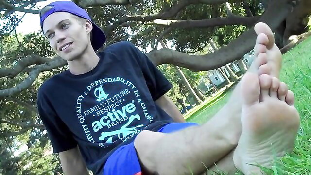Xander shows off Jack's bare male feet soles at park