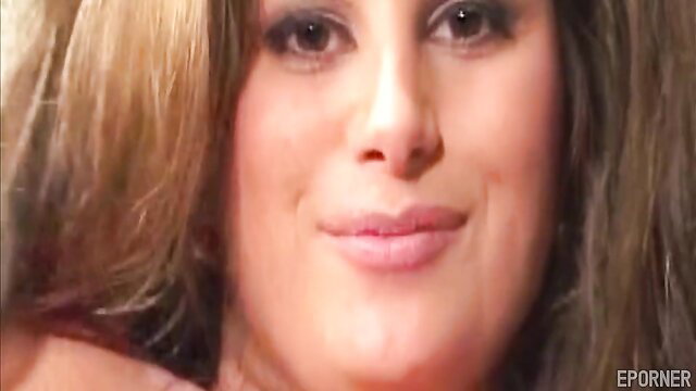 Vintage MILF with big tits smirking closeup in Titty Mania porn