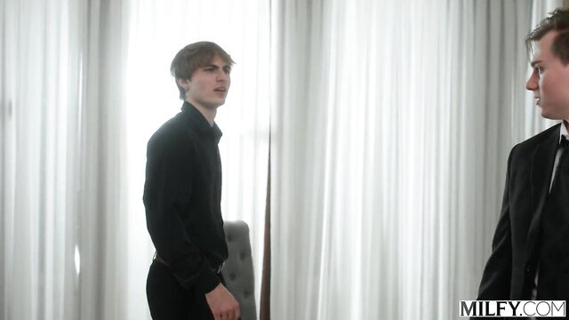 Rachael Cavalli in suit with young studs in bedroom MILFY scene