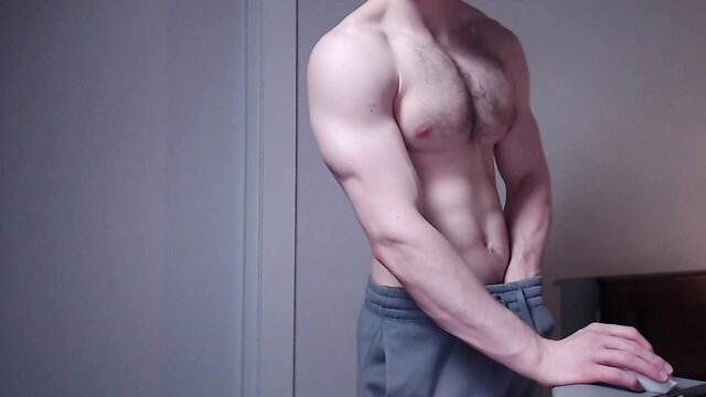 Fit hairy white guy in grey sweats grabs bulge, amateur gay tease