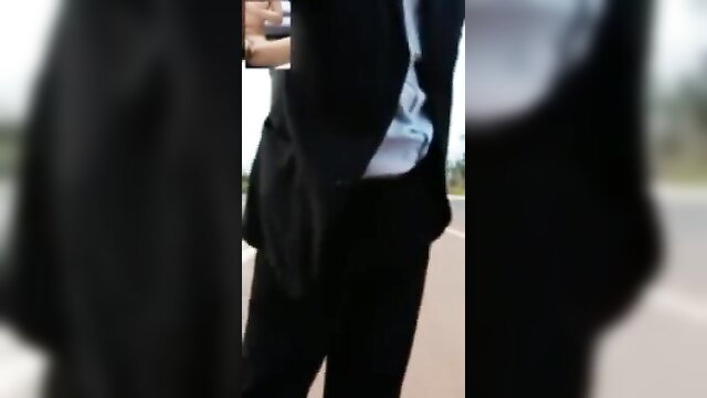 Middle-aged Asian daddy in suit pants down, exposing bulge outdoors